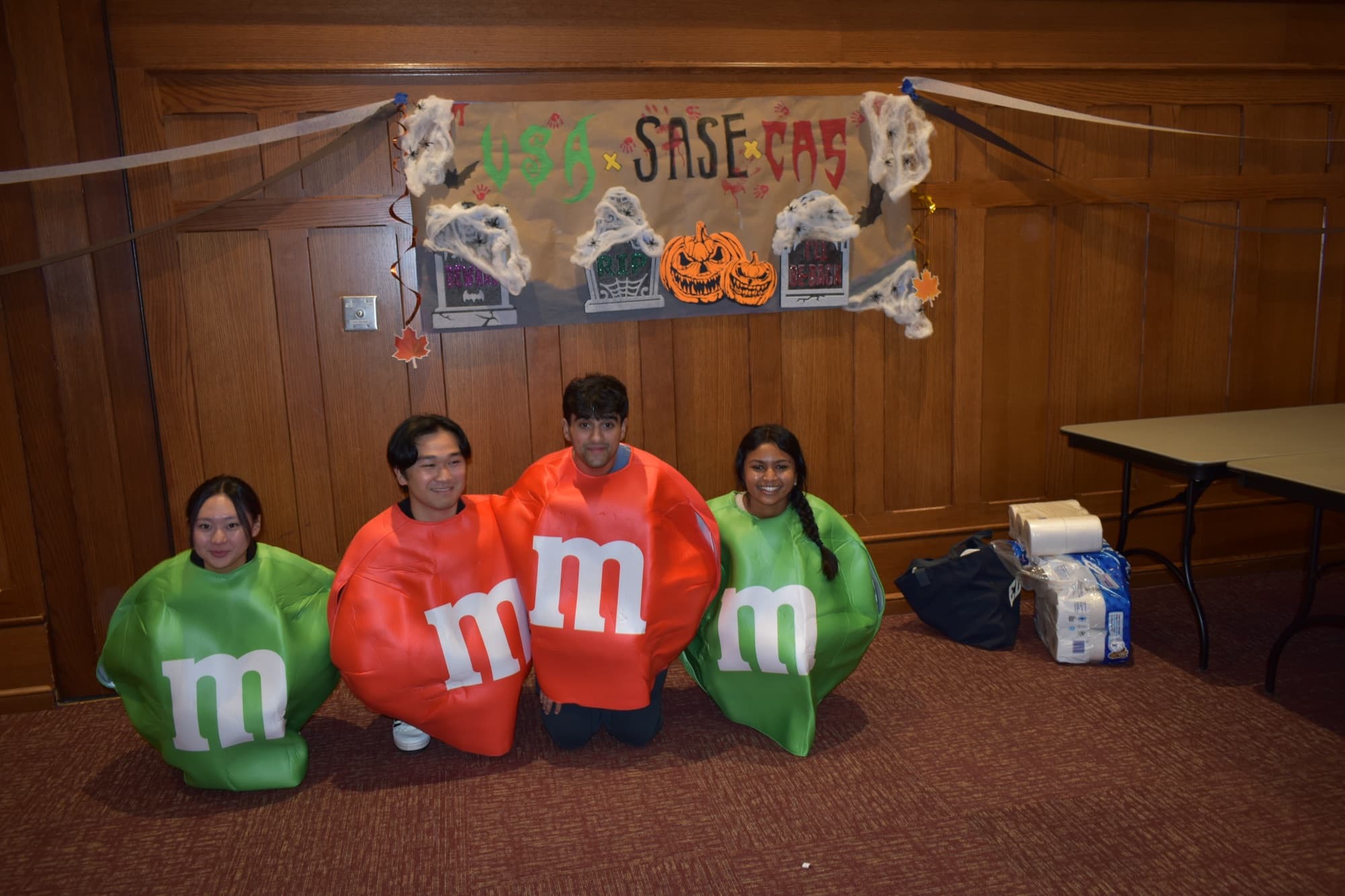 SASE members dressed as M&Ms at a joint Halloween event